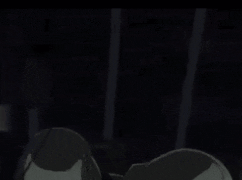 a close up of a robot 's helmet with a purple light coming out of it .