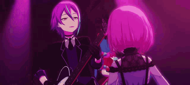 a man in a suit is playing a guitar next to a girl in a pink dress .