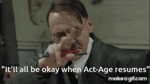 a man with glasses is holding a pen in his mouth and says it 'll all be okay