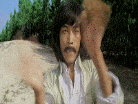 a man with a mustache is wearing a white shirt and a white jacket .