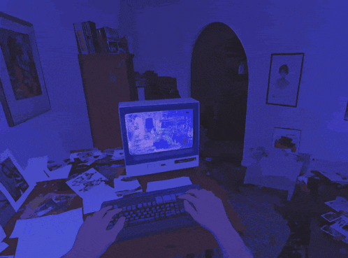 a person 's hand is reaching out towards a window on a tv screen