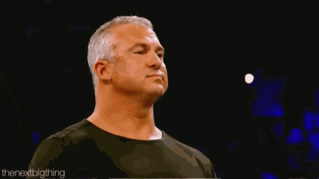 a close up of a man 's face with the nextbigthing written on the bottom right