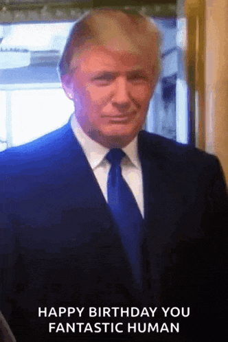 a man in a suit and tie is smiling and says happy birthday you fantastic human