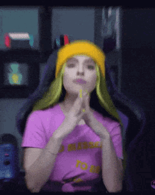 a woman with green hair and a purple shirt that says ' to go ' on it