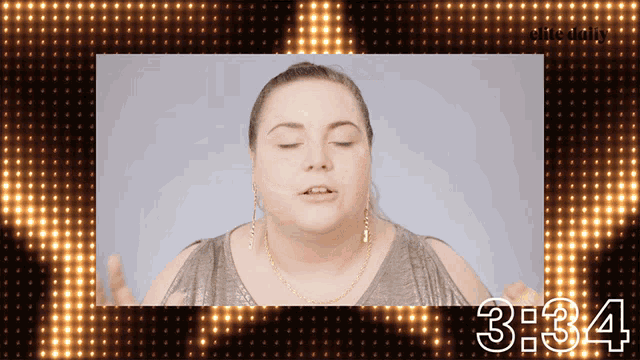 a woman with her eyes closed behind a clock that says 3:24