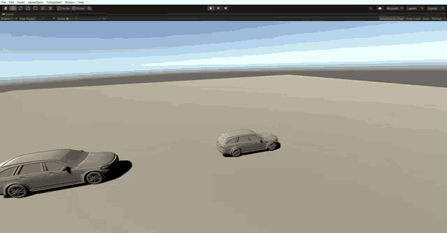 a computer screen shows two cars driving in a field