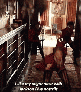 a woman is dancing in a hallway and says i like my negro nose with jackson five nostrils .
