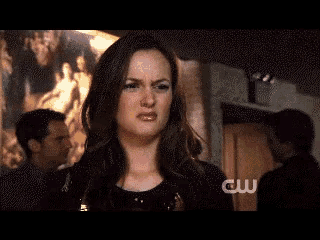 a close up of a woman 's face with the word cw on the bottom right