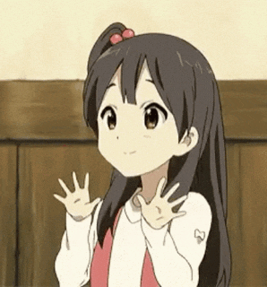 a little girl is waving her hand in the air .