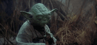 yoda from star wars is playing a flute in the grass .