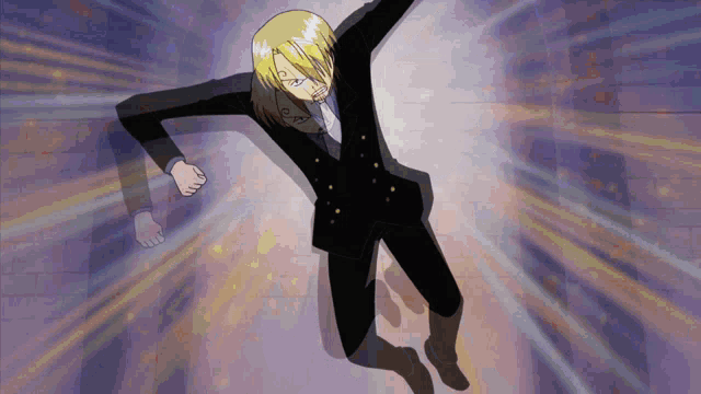 a man in a black suit is kneeling down
