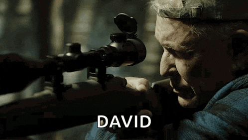 a man is holding a sniper rifle and the name david is on the screen