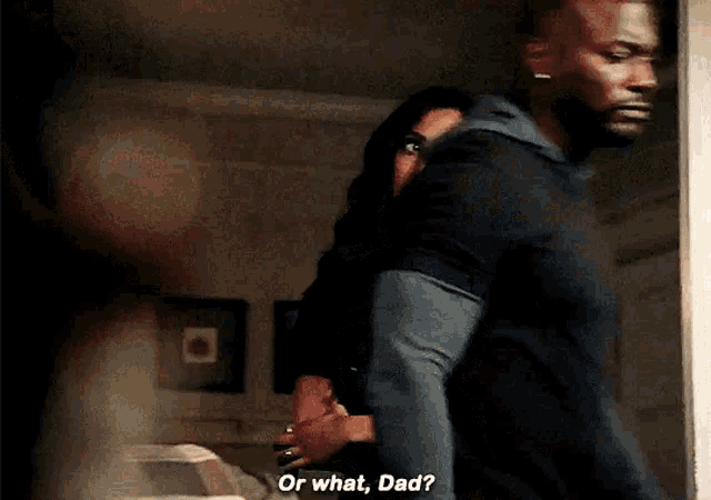 a man and a woman are standing next to each other in a room and the man is asking the woman if she is okay .