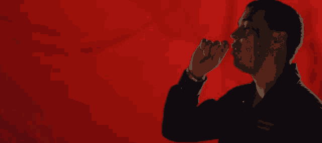 a man in a black jacket with a badge on his sleeve that says ' a ' on it