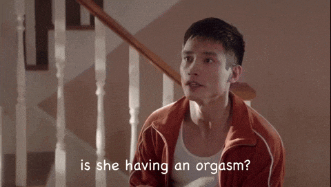 a man is sitting on a set of stairs and asking is she having an orgasm ?