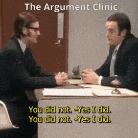 two men are sitting at a desk and talking to each other with the words the argument clinic above them