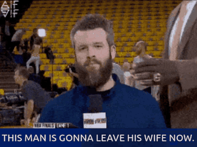 a man with a beard is talking into a microphone with the words this man is gonna leave his wife now below him