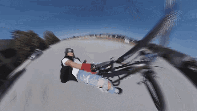 a blurry picture of a person riding a bike on a road