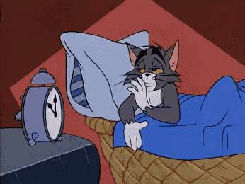 a cartoon cat is laying in bed next to an alarm clock that shows the time as 4:20
