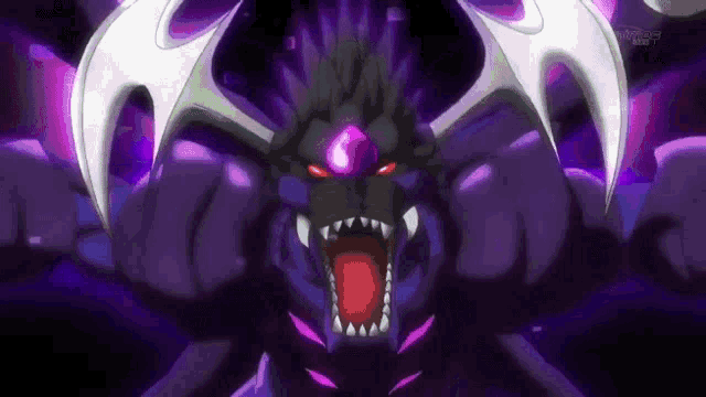 a purple monster with red eyes and sharp teeth is looking at the camera with its mouth open .