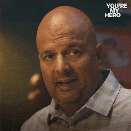 a bald man says " can i ask you something " in a you 're my hero ad