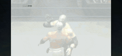 two men are wrestling in a ring with a wwe hd logo above them