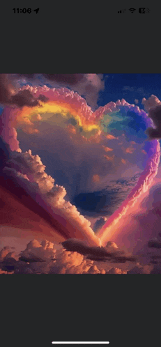 a phone screen shows a heart shaped cloud with a rainbow in the middle