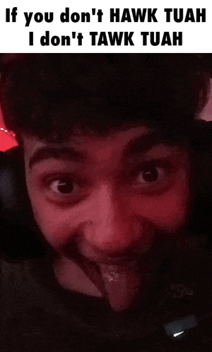a man with a beard is wearing headphones and making a funny face with his tongue out .