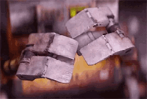 a close up of a robot 's arm with a blurred background