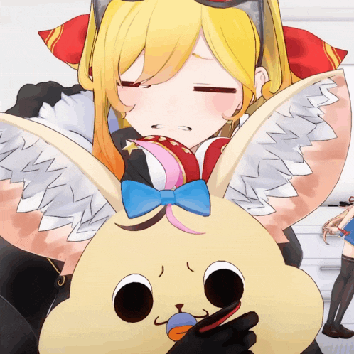 a girl is holding a stuffed animal that looks like a rabbit