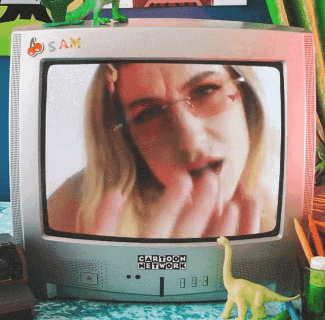 a cartoon network television with a picture of a woman on it