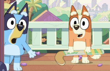 two cartoon dogs are standing next to each other and one is holding a book