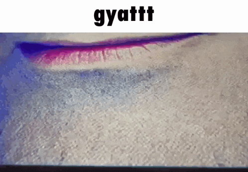 a close up of a person 's lips with the words gyattt written above them .