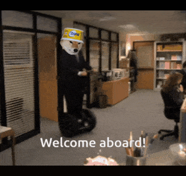 a man riding a segway in an office with the words welcome aboard behind him