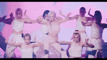 a group of female dancers are performing in front of a screen that says ' scents ' on it