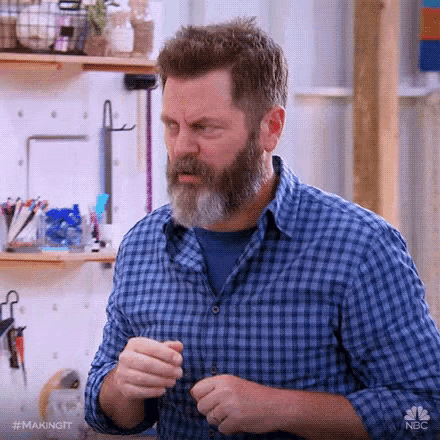 a man with a beard is wearing a blue plaid shirt from nbc makingit