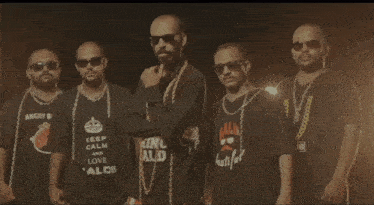 a group of men wearing angry bald t-shirts