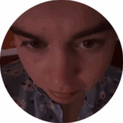 a close up of a person 's face in a round frame