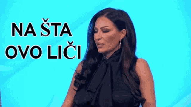 a woman in a black dress stands in front of a blue background with the words na sta ovo lici written above her
