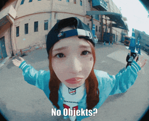 a girl wearing a hat and a shirt that says ' no objekts '