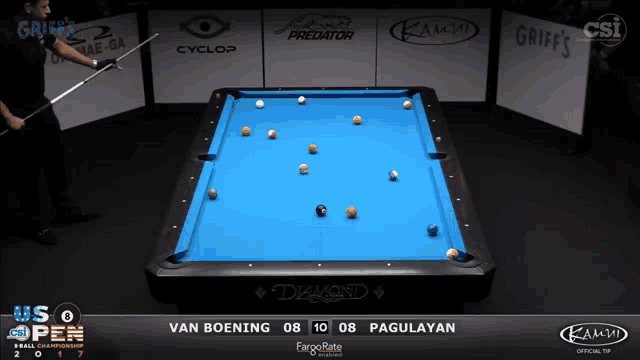 a pool table with a blue cloth and balls on it