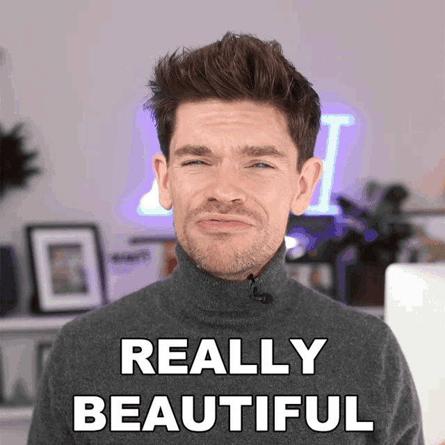 a man wearing a turtleneck sweater is making a face and says really beautiful