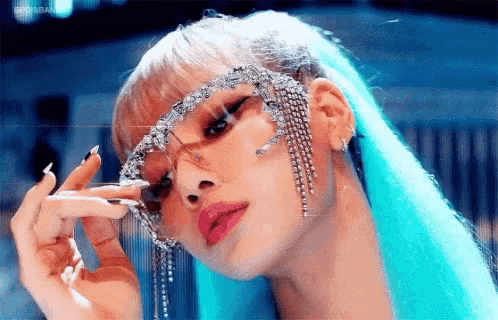 a close up of a woman wearing sunglasses and earrings