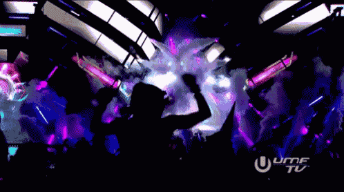 a silhouette of a person dancing in front of a sign that says umf