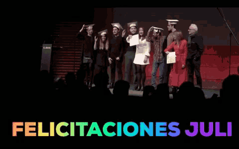 a group of people on stage with the words felicitaciones juli