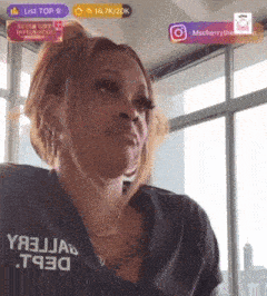 a woman wearing a black shirt that says t930 on it