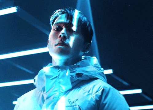 a man wearing a jacket with the word dynafit on the front