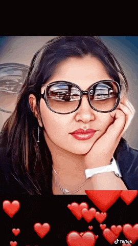 a woman wearing sunglasses is surrounded by hearts