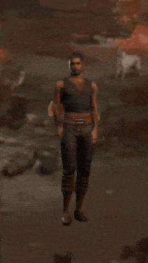 a man wearing headphones is standing in the dirt with his arms outstretched