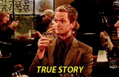 a man in a suit holds a glass of whiskey and says true story in yellow letters